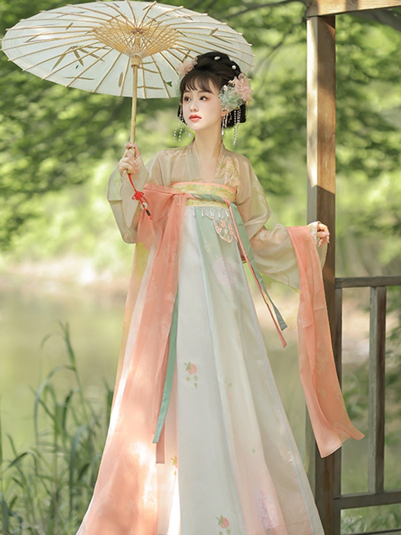 A female model wearing a Satin jacquard Hanfu is immersed in the joy of a spring outing
