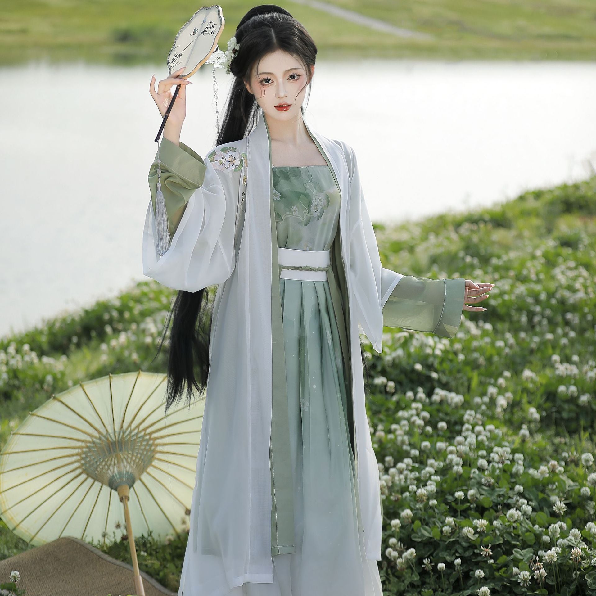 A female model wears a four-piece Hanfu, which is a combination of traditional Chinese Song Dynasty clothing and modern technology fabrics, making you more comfortable